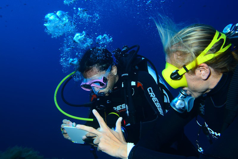 Scuba instructor and student underwater